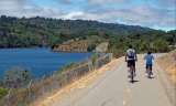 Male and child on bike on a trail